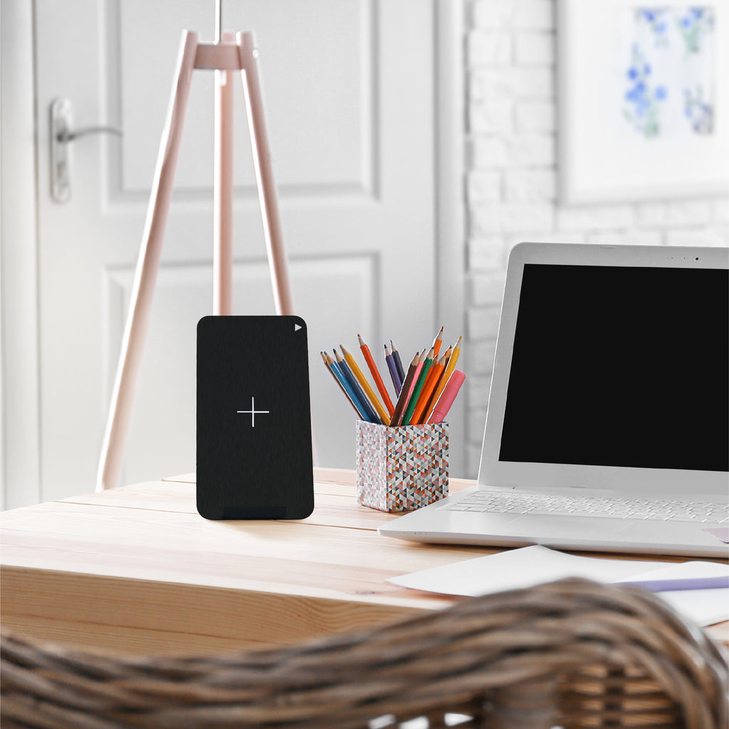 Juice Wireless Charging Stand on a desk next to laptop