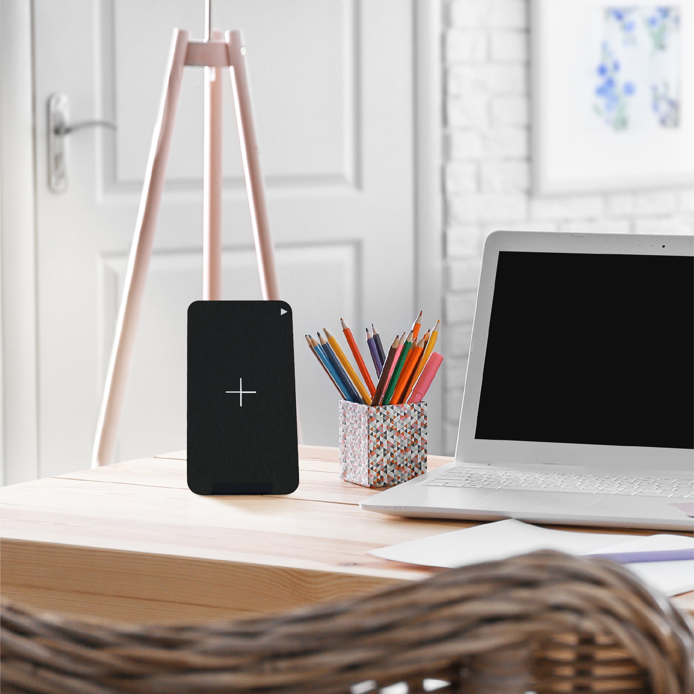 Juice Wireless Charging Stand on a desk next to laptop