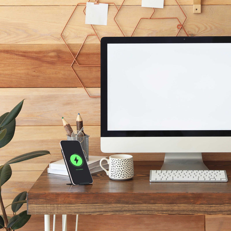 Juice 10 Watt Wireless Charging Stand sat on Desk with iPhone on charge.