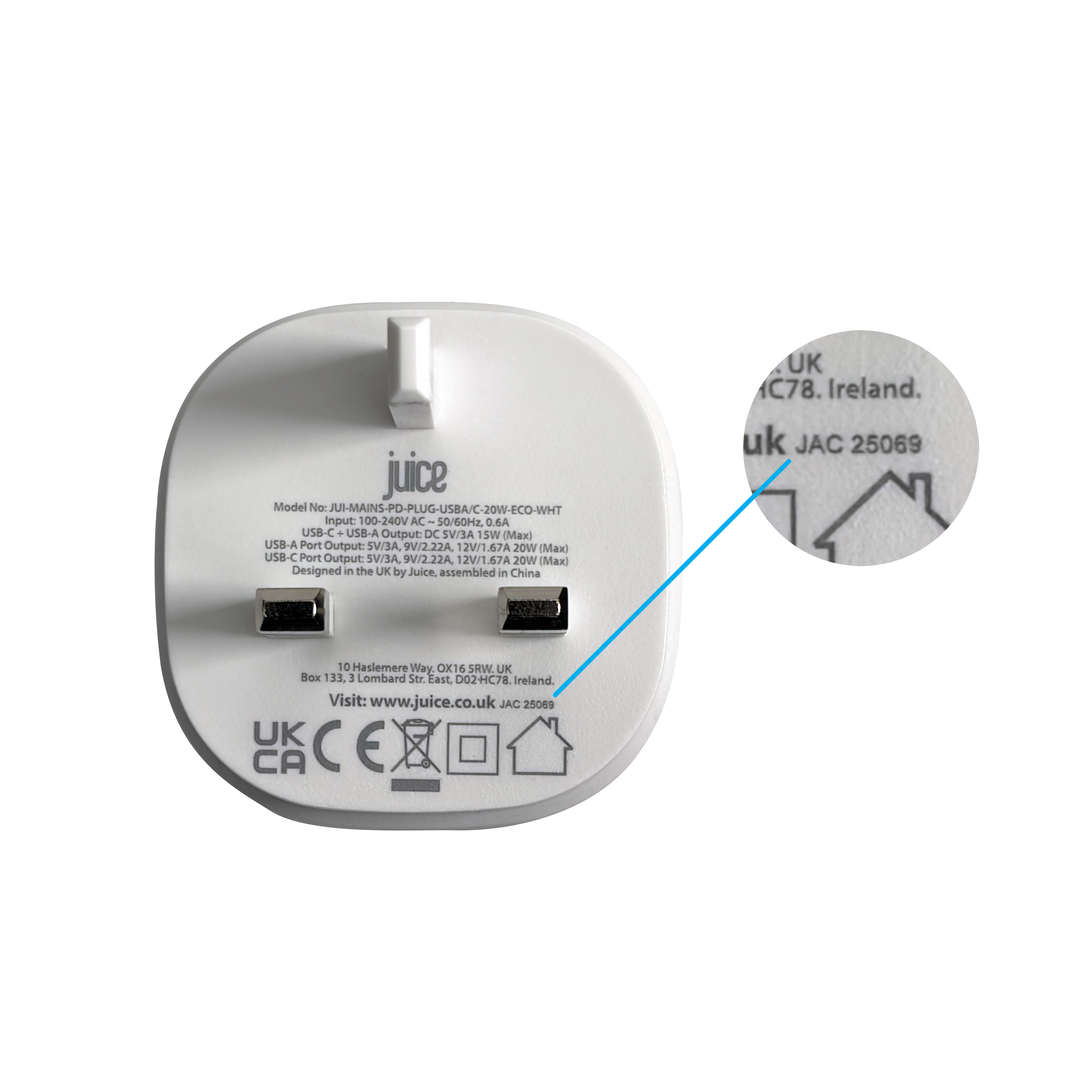 Mains charger with a close-up showing the batch code near the safety symbols